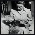 Monica Flaherty feeds pet racoon Zazu, Delcambre, Louisiana