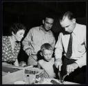 Neighbors examining cooked steak, Saint Mary Parish, Louisiana