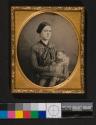 [Young woman holding a deceased infant]