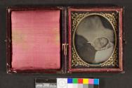 [Deceased woman in white bonnet]