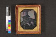 [Deceased girl laid out in checked dress]