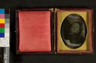 [Deceased boy held by unseen person]