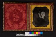 [Deceased woman in white bonnet]