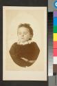 [Deceased child posed as if asleep, with background masked out]
