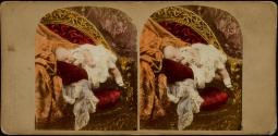 [Deceased baby posed as if sleeping on gilt chair]