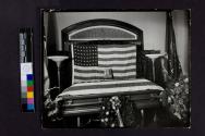 [Closed, flag-draped coffin of policeman or soldier]