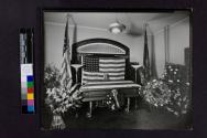 [Closed, flag-draped coffin of policeman or soldier]