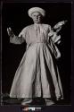 [Fisherman: Rev. John P. Sullivan, S.J. fishing off San Pedro Cay, in the white cassock worn by missionaries in tropical areas.]