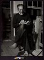 [Honduras Missionary: Rev. Gregory B. Sontag, S.J. reading on the porch of Middlebank Church, British Honduras.]