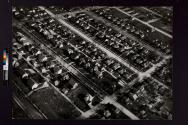 [Aerial view of a suburban neighborhood]