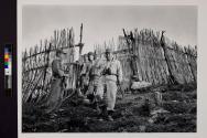 [Chief Han at a primitive mountain fortress ringed by bamboo barricades.]
