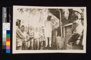 [Hanged man and group of soldiers]