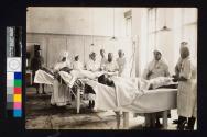 [Patients with nurses in field hospital]