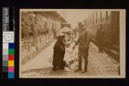 [Woman, children and soldier at train station]