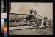 [Group repairing wheels of plane]