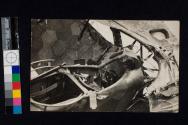 [Cockpit of damaged plane]