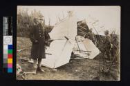 [Soldiers with wreckage of plane]