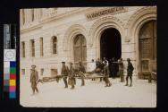 [Soldiers on stretchers outside school converted to field hospital]