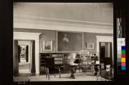 View of living room showing desk & oil painting of Maria K. Eastman