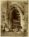 [Woman sitting at Rievaulx Abbey, Yorkshire]