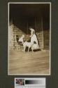 Maria Eastman, nurse and dog on porch, Oak Lodge trip