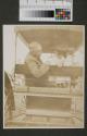 Walter Hubbell and child in wagon, Oak Lodge trip
