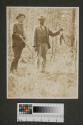 Walter Hubbell and unidentified man with dead squirrel, Oak Lodge trip