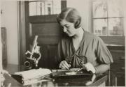 [Girl with microscope & dissecting pan]