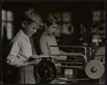 [Students using jig saws]