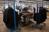 Hickey Freeman factory. Anxhelina, from Albania, sewing lower armhole lining