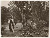 Georgia O'Keeffe and Donald Davidson, pruning a tree, Lake George