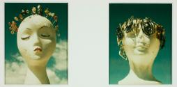 [Sculptures of heads adorned with trinkets]