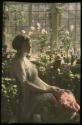 [Woman in conservatory]