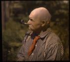 [Mustached man smoking pipe]