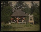 [House with American flag and bunting]