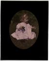 [Baby girl in white dress holding flowers]