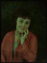 [Woman in pink chiffon jacket]