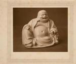 [Smiling Buddha statuette]