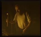 [Blacksmith forming horseshoe]