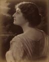[Young woman, head and shoulers profile from back]