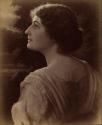 [Young woman, head and shoulders profile from back]
