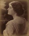 [Young woman, head and shoulders profile from back]
