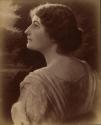 [Young woman, head and shoulders profile from back]