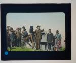 [crowd gathered around man with movie camera]