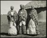 Three Xosa women near Peddie, South Africa, were preparing for a large feast.  The young anthropologist who accompanied us to their village told us that when headgear is worn so low on the forehead it indicates that a woman has only been a mother once.