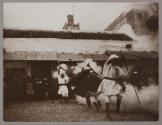 [Soldiers dancing outside building]