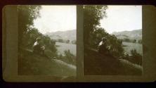 [Will Connell seated on hillside overlooking river, California]