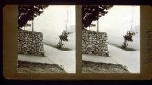 [Stone wall and street scene, California]