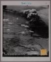 Smoking Japanese Oil Storage tank hit by flyers from Carrier Yorktown in early strikes at Saigon.