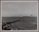 Japanese planes attacking the USS  LEXINGTON (CV 16) during the Marshall Islands raid, as seen from the USS COWPENS (CVL 45).